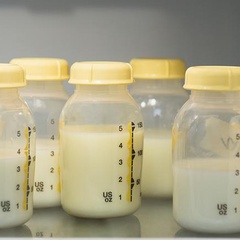 Breast milk in bottles (image: Jamie Grill/The Image Bank)
